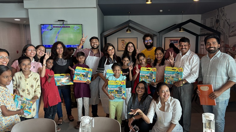 Employees of K Raheja Corp with students at the 'Back to School' campaign